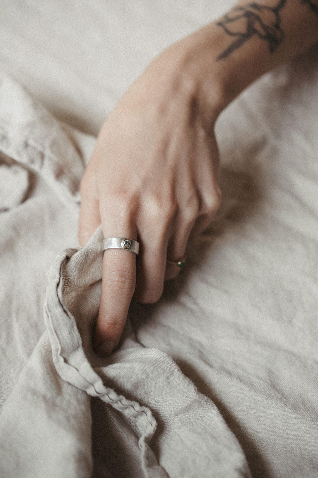 Sterling and diamond hammered wide band ring